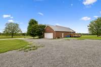 The large gravel driveway and parking pad provide plenty of space for multiple vehicles. 1761 Center Hill Rd. Woodbury, TN 37190