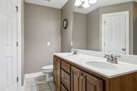 The primary bathroom boasts a spacious double vanity, providing plenty of room for personal items. 1761 Center Hill Rd. Woodbury, TN 37190