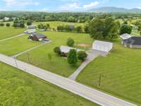 A few mature trees on the property add character and shade, enhancing the peaceful, country atmosphere! 1761 Center Hill Rd. Woodbury, TN 37190