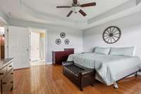 The primary suite features elegant tray ceilings and a ceiling fan, adding a touch of sophistication and comfort. 1761 Center Hill Rd. Woodbury, TN 37190