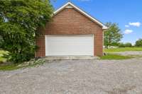 The 2-car side-attached garage is equipped with built-in shelving, providing ample storage to keep everything organized. 1761 Center Hill Rd. Woodbury, TN 37190