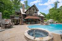 Pool house, hot tub, pool and out door kitchen.
