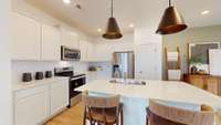 ***This photo was taken from the Grisham model home in Adams Preserve***  The Kitchen Island offers added space for meal preparation and seating for quick meals.