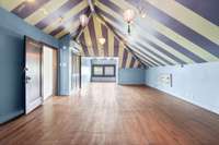On the top floor, you step into a whimsical playroom! This could also be a 4th bedroom as there is a large walk-in closet and half bath. One could possibly add a shower.
