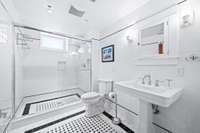 Stylish bath with clean lines on the basement level.