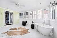 The windows bring in lots of natural light~ they are covered in a frosted window film that allows light while providing privacy.