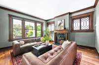 Century old hand craved mantle with marble surround.