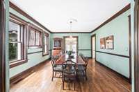 The impressively sized dining room is located between the living room and den and adjoins with the kitchen....perfect for parties!