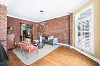 Around the corner from the breakfast room and kitchen is a cozy den that overlooks the pool.