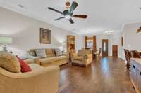 Home offers beautiful hardwood flooring, extensive crown molding, updated fixtures and plantation shutters throughout the home!