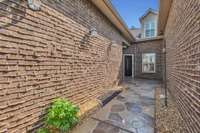 Beautiful stamped concrete leads to the entry of this lovely condo!