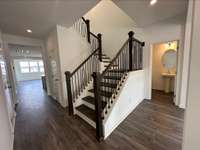 Entry Way with Stairs and Powder Bath