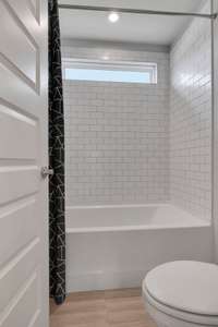 Guest bathroom upstairs. Tile shower available.