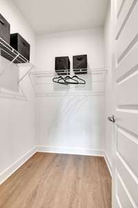 Spacious guest suite downstairs with full bathroom and walk-in closet.