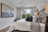 Spacious guest suite downstairs with full bathroom and walk-in closet.