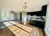 Nice cabinetry, an open floor plan, and lots of light create an inviting space