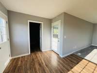 Side door to front carport and back door to deck. The center door in this picture is to the laundry room.