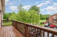 Deck overlooking the green space across the street
