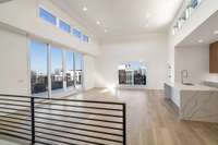 Main floor living / kitchen / dining offering 270 degree condo penthouse views