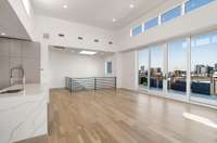 Main floor living / kitchen / dining offering 270 degree condo penthouse views