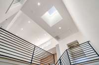 Skylight at the top of the stairs cascades light all the way down the stairs