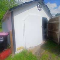shed located in driveway/lawn mower storage,etc
