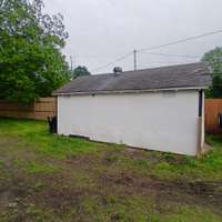 side view of driveway shed..lots of rain