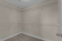 Primary bedroom walk-in closet.