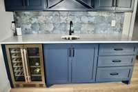 upstairs bar with beverage refrigerator