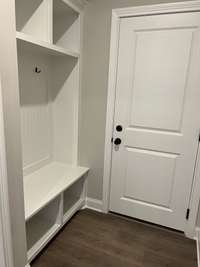 Bench with hooks coming in from garage.