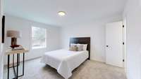 MASTER BEDROOM WITH NEW CARPET.