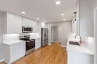 Fully renovated kitchen with new cabinets, counter tops and applainces