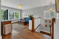Upstairs landing serves as a bonus room/casual entertainment space.