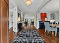 As you enter, you can enter the office/4th bedroom on the left, dining room on the right, or head straight to the living room and kitchen.