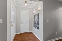 Entryway with coat closet.