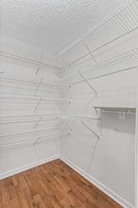 Large Pantry right off the Kitchen. Very convenient for cooking, but nice and tucked away. It boast of plenty of storage shelves.