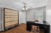 First Bedroom boast of a Murphy Bed! Great for your out-of-town guest, but not in the way when not in use. Currently this room was used for an office. Great Window view. Also oversized walk in closet in this room, as well as the other bedrooms