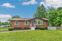 Front of home has a covered front porch with new landscaping. This home is truly move in ready and has been very well kept.