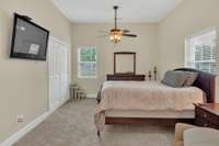 Efficiency apartments bedroom features double door closet and two windows for egress.