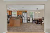 Newly remodeled eat in kitchen features stainless steel appliances. Plenty of room to entertain.
