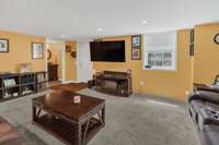 Downstairs onus room has excellent natural lighting as well as upgraded custom lighting. Perfect area to get away and enjoy a movie or sports game on television.