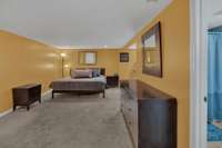 Lower level master bedroom has plenty of room for furniture, a separate sitting area and its own full bathroom with separate vanities.