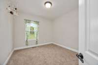 Downstairs guest bedroom located to the right of the full bathroom.