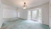 This is showing the dining room looking back into the living room.