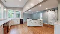 Notice this spacious island between the kitchen and the den area - without separating the cook from the party!!