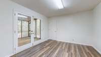 This large room is the laundry room.  Wow!  Don't we all wish we had a laundry room this large!!!  It also has a closet and entry to the screened-in porch.