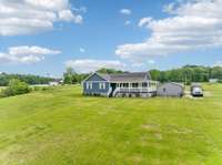 This charming 3-bedroom, 2-bath home sits on a gorgeous 3.66 acre corner lot.