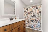 Master bathroom that has a walk-in closet.