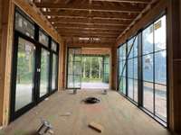 Dining Room with ample windows * this home is under construction. Photo taken 6/17/25