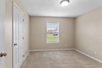 Bedroom #3. Newer carpet throughout.